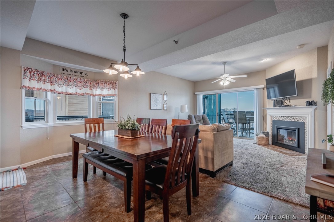 SELLER TO PAY the first 6 months of HOA Fees at closing! This unit at The Falls features 3-bedroom, 2-bathroom and offers breathtaking lake views, modern comforts, and resort-style amenities. Inside your end unit you enter into an open-concept living area with large windows, filling the space with natural light and showcasing stunning waterfront views. The kitchen features sleek countertops, stainless steel appliances and countertop seating perfect for entertaining. The spacious master suite boasts deck access, a walk-in closet, and an en-suite bath with dual vanities. Two additional bedrooms provide plenty of room for guests or a home office. Relax on the private covered deck, ideal for enjoying your morning coffee or sunset cocktails overlooking the lake at the 3mm. This unit also includes a fireplace, in-unit laundry, completely turn key and a 12x28 boat slip just below the unit. As a resident of The Falls, you’ll enjoy two lakeside pools, tennis courts, a clubhouse, and a playground. Topping off this complex you are located in a prime location near shopping, dining, and entertainment. This property has established rental income making it the ideal investment opportunity.