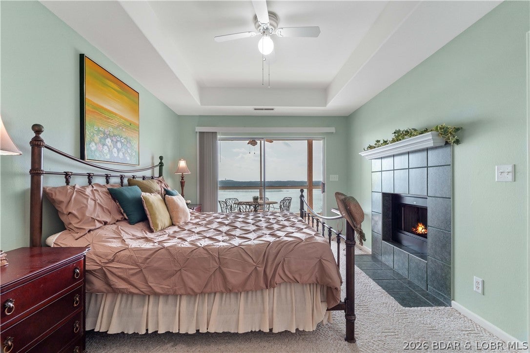 Big lake views, a great location, and everything you need to start enjoying the lake right away! This well-maintained, fully furnished 2-bedroom, 2-bath condo offers unobstructed main channel views in a peaceful setting down HH, while still being just minutes from Osage Beach shopping, dining, golf, and entertainment. The open floor plan flows out to a screened deck where you can relax and take in those incredible lake views. The HVAC was replaced just two years ago, and nightly rentals are allowed, giving you the option to use it as a weekend getaway, full-time home, or investment property. A 12x28 boat slip plus PWC slip are included. Even better, the condo is directly across from one of two community pools and the tennis courts. Amenities also include a clubhouse, fitness area, and double storage. Fully furnished, turn-key, and ready for lake season!