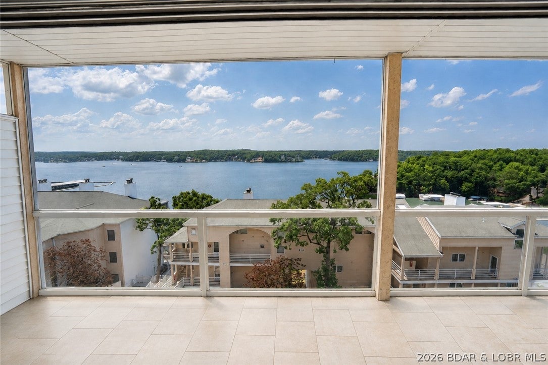 Unobstructed main channel views that are W O W! Enjoy easy lake living from this well-maintained, fully furnished 2-bedroom, 2-bath condo located down HH in a peaceful setting just minutes from Osage Beach shopping, dining, golf, and entertainment. The open floor plan leads to a screened deck with beautiful lake views, providing a comfortable space to relax or entertain. The HVAC was replaced just two years ago, adding value and peace of mind. Nightly rentals are allowed, making this an excellent full-time residence, weekend retreat, or investment property. A 12x28 boat slip plus a PWC slip are included for quick access to the water. Conveniently located directly across from one of two community pools and the tennis courts, you'll also enjoy a clubhouse, fitness area, and double storage. This turn-key condo is ready to enjoy from day one.