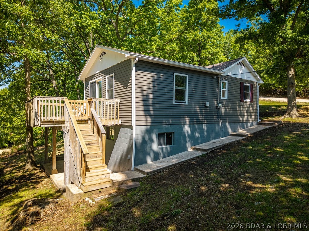 Beautifully updated 2-bedroom home sits on a nearly half-acre lot in a great neighborhood with lake views and lake access. This property offers the perfect blend of comfort, outdoor space, and lake living. Room to add a garage or workshop and plenty of possibilities for expanding with this large, over-sized lot.  Recent improvements include an updated kitchen and bath, newer flooring, windows, siding, deck boards, and roof—making this home move-in ready. Enjoy relaxing on the spacious deck or entertaining in the large yard with plenty of parking for guests, boats, or trailers.  Lake access is just a short walk away, making it easy to enjoy days on the water. Whether you’re looking for a weekend getaway, investment opportunity, or full-time residence, this property checks all the boxes!