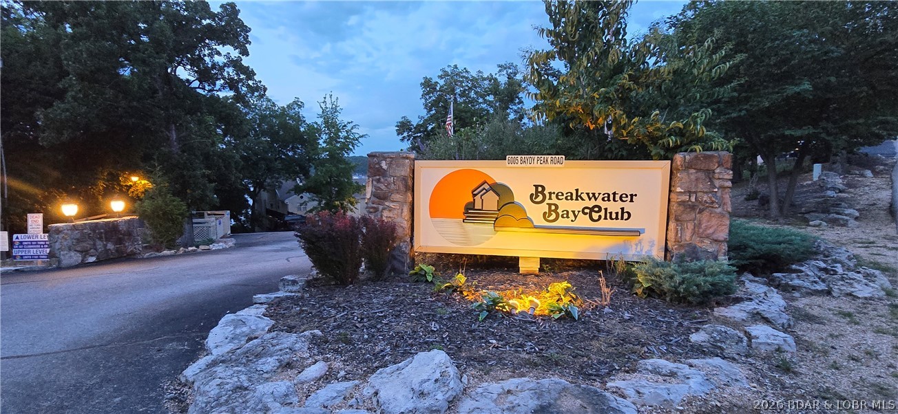 Rare opportunity to own in the highly sought-after Breakwater Bay Club at the 22 MM, where every condo enjoys breathtaking main channel views and unforgettable sunsets. This beautifully maintained community features premium recent upgrades, including new composite egress decking with aluminum rails, pathway lighting, extensive pool improvements including LED lighting, and newly installed premium boat docks, enhancing both property values and the exceptional lakefront lifestyle. This 2nd-tier, open-floor plan condo offers 3-beds, 2-bath, full size laundry room and the perfect opportunity to update and customize to today's design preferences. The expansive covered and screened in concrete deck spans the entire lake-facing side of the condo, creating an incredible outdoor living space for entertaining, relaxing, and taking in the panoramic views. The seller is seeking a quick closing, and the property is being sold as-is, making this an outstanding opportunity for buyers looking to add their personal touch. Opportunities like this in Breakwater Bay Club don't come along often—schedule your showing today and join the welcoming community of owners. Sit back, relax, and enjoy lake time!