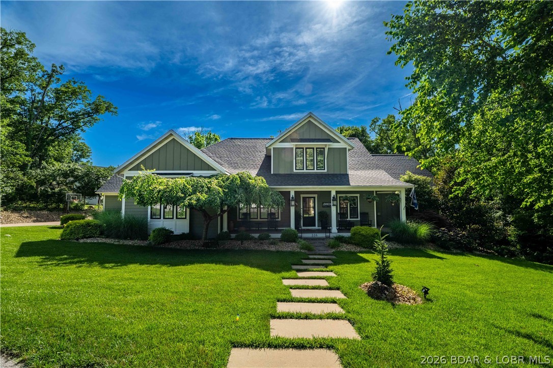 Opportunity at Osage National, this sprawling estate sits on two lots at the end of a quiet cul-de-sac and offers over 5,400 square feet of beautifully updated living space. EVERYTHING you see stays, even the golf cart and pool equipment. Designed for those who love to entertain, the home features multiple gathering areas, a stunning remodeled kitchen with gas range, double ovens, custom cabinetry, & an inviting hearth room. The backyard feels like a private resort with a heated and chilled pool, screened porch, open-air deck, & fenced yard surrounded by mature trees for exceptional privacy. The thoughtful floor plan offers comfortable main-level living along with a private guest suite and abundant space for family and friends. Hardwood floors, two gas fireplaces, three HVAC systems, a flat driveway, oversized 3-car garage, mudroom with built-ins, & a new roof in 2025 add everyday convenience. Enjoy golf cart access to championship golf, Eagle View Bar & Grill, the community pool, & all the amenities that make Osage National one of the Lake's premier communities. Minutes from nearby marinas, this is a rare combination of luxury, privacy, and lifestyle that's difficult to replicate.