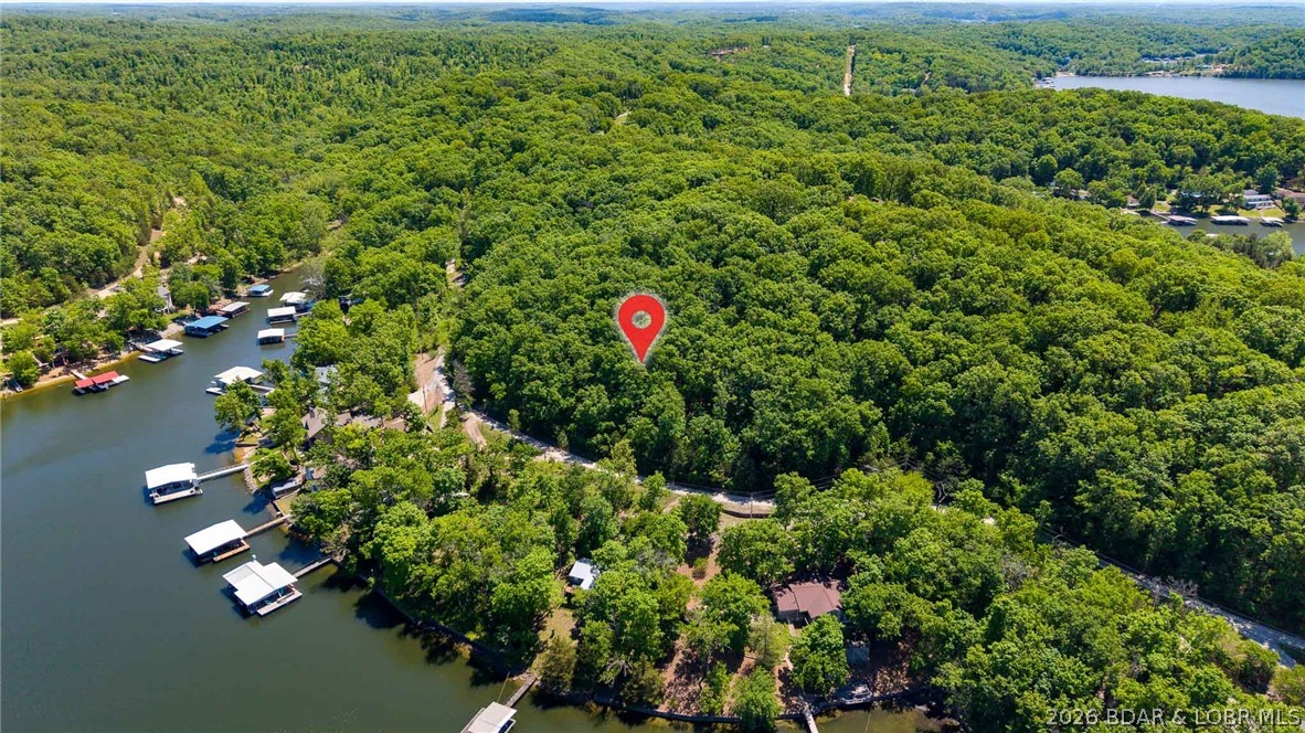 Don’t miss this incredible opportunity to own 2.76 acres in Rocky Mount with beautiful lake views of Lake of the Ozarks. This spacious parcel offers the perfect setting to build your dream home or private getaway. Enjoy the peaceful surroundings, abundant wildlife, and the convenience of being just a short drive to dining, entertainment, and lake access. Whether you’re looking to build now or invest for the future, this property offers endless potential. Don't miss out!!!!
