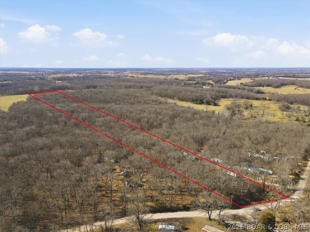 Discover the freedom and possibility of 5.75 beautiful wooded acres just about four miles north of Eldon.

Tucked away in the quiet countryside, this fully wooded tract offers the kind of privacy and peace that’s getting harder to find. Mature trees stretch across the entire property, creating a natural canopy and the perfect setting for a future homesite, weekend retreat, or hunting getaway. Whether you’re dreaming of building a cabin in the woods, parking a camper for fall weekends, or simply owning a slice of ground to explore and enjoy, this property gives you room to breathe.

With no improvements, you have a blank canvas — no restrictions from someone else’s vision, just raw land ready for yours. Carve out trails, create a clearing for a home, or leave it untouched and enjoy the sights and sounds of nature just minutes from town.

Conveniently located close enough to Eldon for shopping, schools, and amenities, yet far enough out to feel truly removed, this acreage offers the best of both worlds: accessibility and seclusion. If you’ve been waiting for the right piece of ground to call your own, this could be it.