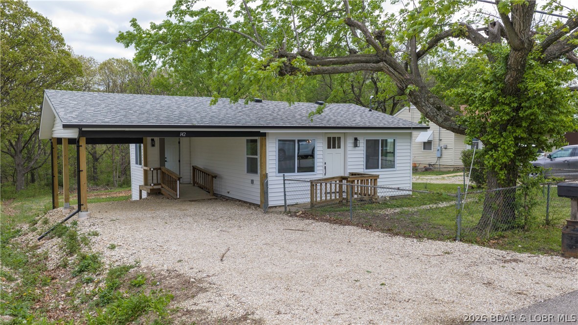 Freshly remodeled in 2026, this move-in-ready home in the heart of Camdenton offers a perfect blend of modern updates and everyday convenience. From the moment you arrive, you’ll notice the fresh exterior with brand-new siding and a new roof, providing both curb appeal and long-term peace of mind. Inside, the updates continue with all-new flooring and appliances, creating a clean, modern feel throughout. The home features an open floor plan designed for comfortable, connected living, highlighted by vaulted ceilings in the living room that add volume and natural light to the space. The functional layout offers flexibility for a variety of lifestyles, while the attached carport provides convenient covered parking. Step outside to a generously sized backyard—ideal for relaxing, entertaining, or outdoor enjoyment. Located within the city limits of Camdenton, this property offers easy access to shopping, dining, schools, and other local amenities. Whether you're searching for a full-time residence or an investment opportunity, this fully updated home is ready to go. Schedule your showing today!