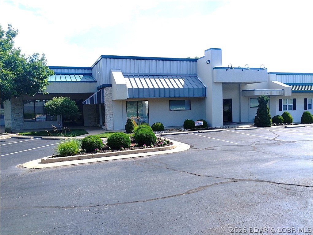 5513 Osage Beach Parkway in Lakeshore Plaza in Osage Beach. It is conveniently located next to the Osage Beach post office and across the street from the entrance to Lake of the Ozarks State Park. This one-level unit contains 2,040 square feet. It has central heat and air, a ½ bathroom, 3 private offices, 2 smaller open offices, large meeting area, and storage room/kitchenette. Can be combined with adjacent unit for a total of 4,117 square feet. Monthly charge is $1,986 and that includes your share of city water, city sewer, landscaping, lawn care, parking lot snow removal, outdoor electricity, real estate taxes, and insurance. These expenses are analyzed annually, and adjustments in tenant monthly costs may vary. Broken down, the rent is $1,759.00 per month and CAM (common-area maintenance) is $227 per month.