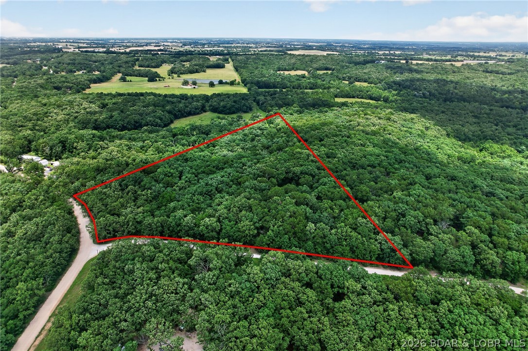 Looking for freedom, privacy, and room to grow? This 7.75-acre Morgan County property offers the perfect blend of usability and seclusion with NO HOA and NO restrictions! Whether you're ready to build your dream home, start a homestead, hobby farm, create a weekend retreat, or simply park your RV and enjoy the outdoors, this property is ready for your vision. The land features gentle terrain, abundant wildlife, and a peaceful country setting with a nice driveway already in place off a well-maintained gravel road. A water well with pump is on site, providing a valuable head start for future improvements. The included storage shed and picnic table make it easy to begin enjoying the property immediately. Conveniently located yet tucked away from the hustle and bustle, this is a rare opportunity to own acreage with the flexibility to use it your way. Bring your plans, your RV, or your dreams and make this beautiful piece of Morgan County yours today!