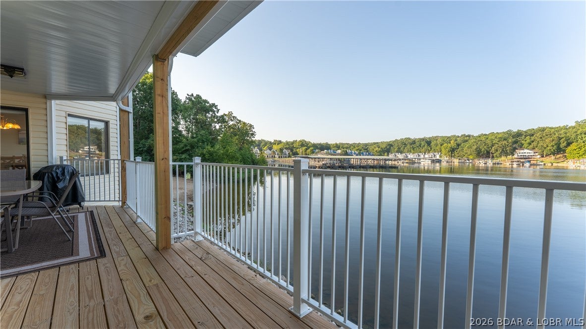A waterfront condo like this almost never hits the market. This rare 3-bed, 3-bath waterfront condo offers one-level living with zero steps from the front door to the dock. All bedrooms are generously sized, with two full en-suites and direct bathroom access from every bedroom — an exceptional layout for owners and guests. The primary suite features a huge walk-in shower, adding a luxury touch to the already impressive floor plan.

Enjoy two boat slips directly in front of the unit, allowing you to see your watercrafts from inside while the dock sits slightly off to the side, creating unbelievable panoramic lake views that feel like you’re sitting right on the water. A beach area lies just off the opposite side of the building, with a wide open cove stretching out in front.

Inside, you’ll find a large open kitchen, a new deck (2026), and a detached garage — the closest one to the unit. Perfectly positioned in one of Osage Beach’s most desirable areas, you’re surrounded by restaurants, shopping, and conveniences by both land and water. Clean, updated, and steps from pools, beach areas, and the docks — a truly rare opportunity to secure a spacious waterfront like this.