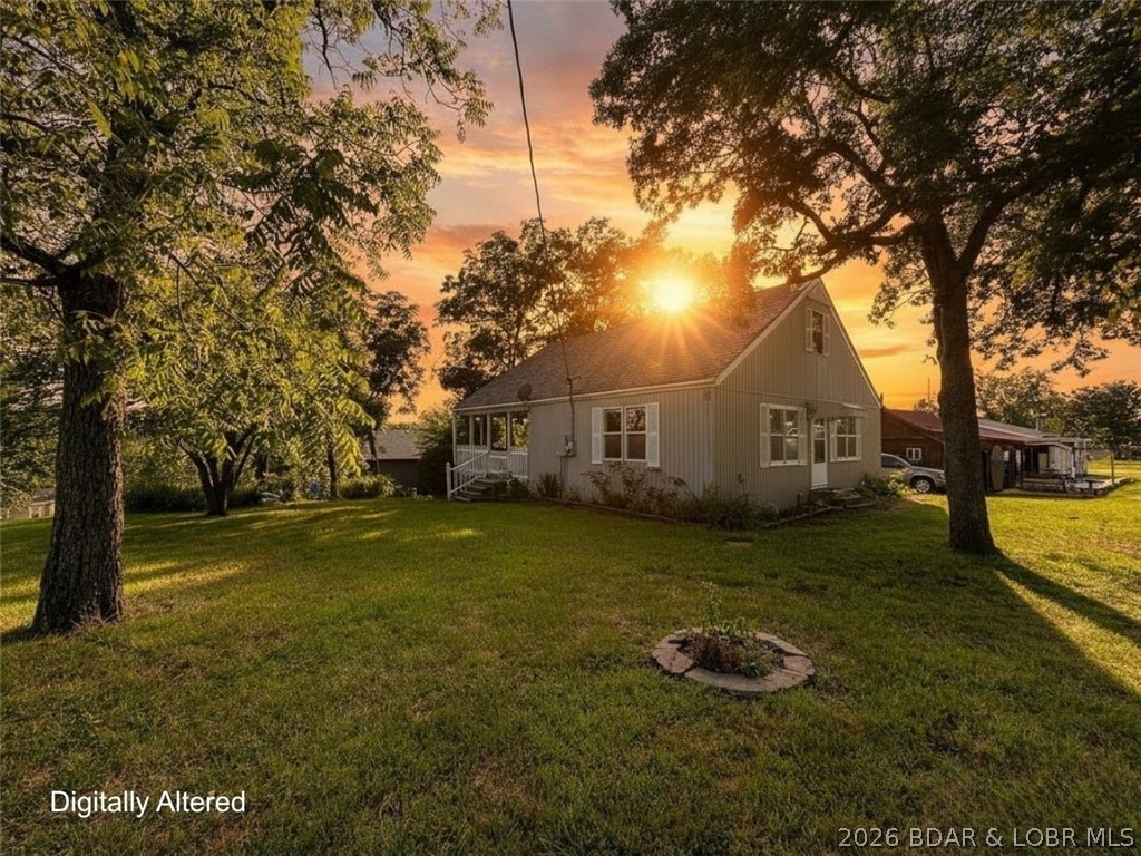 Every now and then, a home comes along that simply feels like the right place to slow down and enjoy life. Tucked into the Paradise Point community, this inviting 3-bedroom, 2-bath home blends modern updates with the relaxed lifestyle that draws so many to the Truman Lake area. The open floor plan creates an easy gathering space, while the kitchen features butcher block countertops, stainless steel appliances, and thoughtful finishes that add warmth and character. The main-level primary bedroom offers daily convenience, while 2 additional bedrooms and a bathroom upstairs provide flexible space for guests, hobbies, and more. Outside, the detached garage offers ample space for vehicles, tools, and all the gear that comes with lake living. With community access to a boat ramp at the 84 MM of Lake of the Ozarks, a swim area, and Truman Lake just moments away, weekends can be as adventurous, or as peaceful, as you choose. This isn't just a home near the lake…it's a place to enjoy the lifestyle that comes with it.
