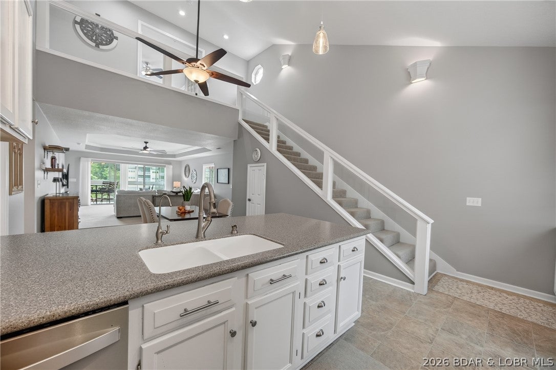 This two-story condo is thoughtfully laid out for both everyday living and entertaining. The main level includes two junior suites, giving guests or family their own comfortable space without stairs. Upstairs, the massive primary suite is set apart from the rest of the home, offering outstanding lake views and true privacy.

A wall of glass runs through the main living space, pulling in natural light and putting the lakeside setting on full display.

Outside, two private balconies made for evenings under the stars, overlooking the lake.  The community's sparkling pool and well-kept grounds make it easy to meet neighbors or host visitors. This non rental community shows pride of ownership throughout. 

A 12'x30' boat slip and two PWC slips are included, so the water is always within reach right in front of the condo! Ideal for full time or weekends!