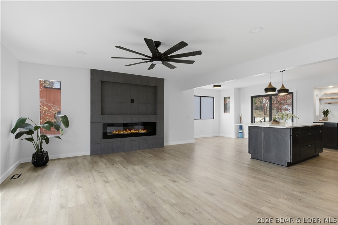 Newley Renovated Throughout!!!! Welcome to this stunning 4 bedroom 3 bathroom home, bonus room / office in the primary bedroom. Enjoy seasonal lake views from the second tier, perfect for relaxation .This fully remodeled gem boasts a brand-new roof, New Kitchen and bathrooms. Every inch of this home has been upgraded. Open floor plan adorned with new luxury vinyl plank flooring throughout. The custom cabinets and new ceiling fans in every room. The spacious living area flows seamlessly into the kitchen, ideal for entertaining family and friends. Outside, you'll find ample open decking and a large yard, perfect for gatherings .Take advantage of the community dock with a boat slips available for your water adventures, as well as a refreshing community pool for those hot summer days. Don’t miss out on this opportunity—schedule your showing today!