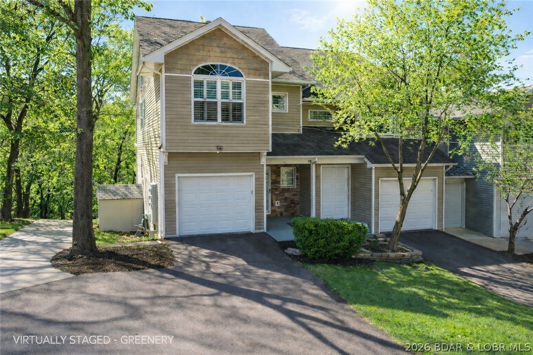 Hard-to-find end-unit townhome in the heart of Lake Ozark with NO HOA dues, over 2,300 sq ft, a 1-car attached garage, and a location that puts you close to everything buyers love about Lake of the Ozarks. Excellent long-term rental potential. This 3 bedroom, 3 full bath, 1 half bath townhome offers a spacious multi-level floor plan with room to spread out, entertain, and enjoy easy lake-area living. Main level features the primary living room, kitchen, and dining area. The walkout lower level includes a second family room, wet bar, additional dining space, and flexible room for a game room, media room, or man cave. The backyard patio offers extra outdoor space for relaxing, a fire pit, or entertaining guests. End-unit privacy means only one shared wall, and the zero-scape landscaping means low-maintenance ownership with no mowing. Located near marinas, boat slip rentals, shopping, popular restaurants, bars, and the Bagnell Dam Strip. This property is perfect as a full-time home, weekend getaway, or investment in a highly desirable Lake Ozark area.