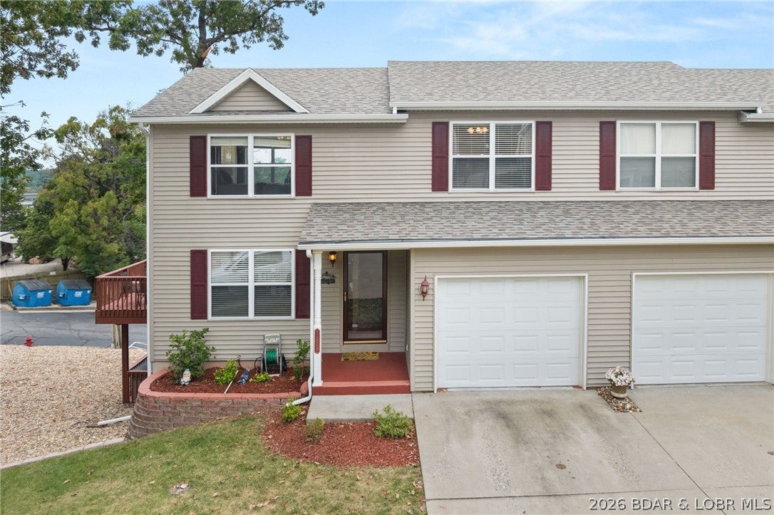 What a wonderful home located in Osage Beach that features an nearly panoramic view of the lake. This 2-story townhome features 2 bedrooms, 3 full baths, and 1 half bath, with an inviting open-concept floor plan the main level is highlighted by wood floors, granite kitchen countertops, and stainless steel appliances. Step outside onto expansive deck space ideal for relaxing while taking in the scenery. The second floor hosts the large primary suite, 2nd bedroom and bathroom, and laundry room. There is an  attached 1-car garage that adds everyday convenience. The lower-level walk-out boasts recent updates, including new LVP flooring, new ceiling tiles, freshly painted walls, and new blinds. Exterior upgrades include a new roof and new gutters. Community amenities feature a refreshing pool and city-maintained streets for easy access. Whether searching for a primary home or long-term rental investment, 1229 Pinewood Drive delivers quality, space, and a great location!