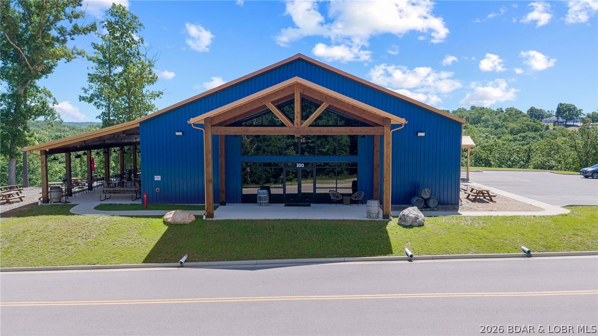 11 acres of endless opportunity in the heart of Lake of the Ozarks - Zoned C2! This stunning 12,000+ sq ft architectural showpiece is more than a winery or restaurant — it’s a destination property built for entertainment, hospitality, events, and future expansion. Located in a Tif District! This versatile property is perfect for a wedding venue, brewery/distillery, live music venue, boutique hospitality concept, mixed-use development, Year Around RV Resort or upscale investment opportunity.  Inside features locally sourced red oak from the property itself, vaulted spaces, exposed ductwork, multiple bar areas, a stocked commercial kitchen, conference/offices, and over 3,200 sq ft of patio space. The venue currently accommodates 200+ guests for public and private events. The flat, usable acreage behind the building creates incredible potential for outdoor weddings, cabins, short-term rentals, additional event space, or future development. Designed with expansion in mind, this is a rare opportunity to own a scalable destination property with unlimited upside at the Lake.