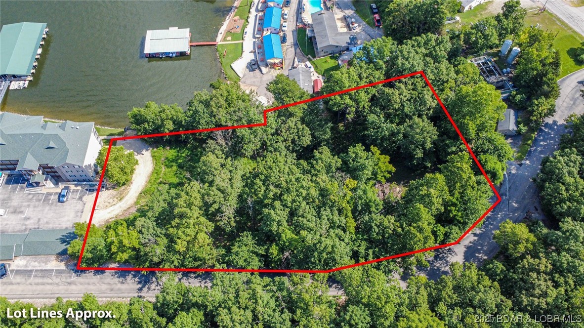 Incredible development opportunity at the 3-mile marker of the Big Niangua, just past the popular Four Corners area. This rare lakefront offering includes over two acres of prime property with unbeatable potential. Located adjacent to the brand-new Niangua Commons condos, this site is surrounded by new growth and activity. Hard surface roads provide easy year-round access, and the property boasts both an exceptional water views, as well as a convenient road location for future access and visibility. Whether you're looking to create a multi-family project, or a lakefront investment, this property is ready for your vision. With utilities nearby and gentle topography, the groundwork is in place for development. The possibilities here are endless—act now and bring your dream project to life. GIS property lines attached to listings may not be accurate.