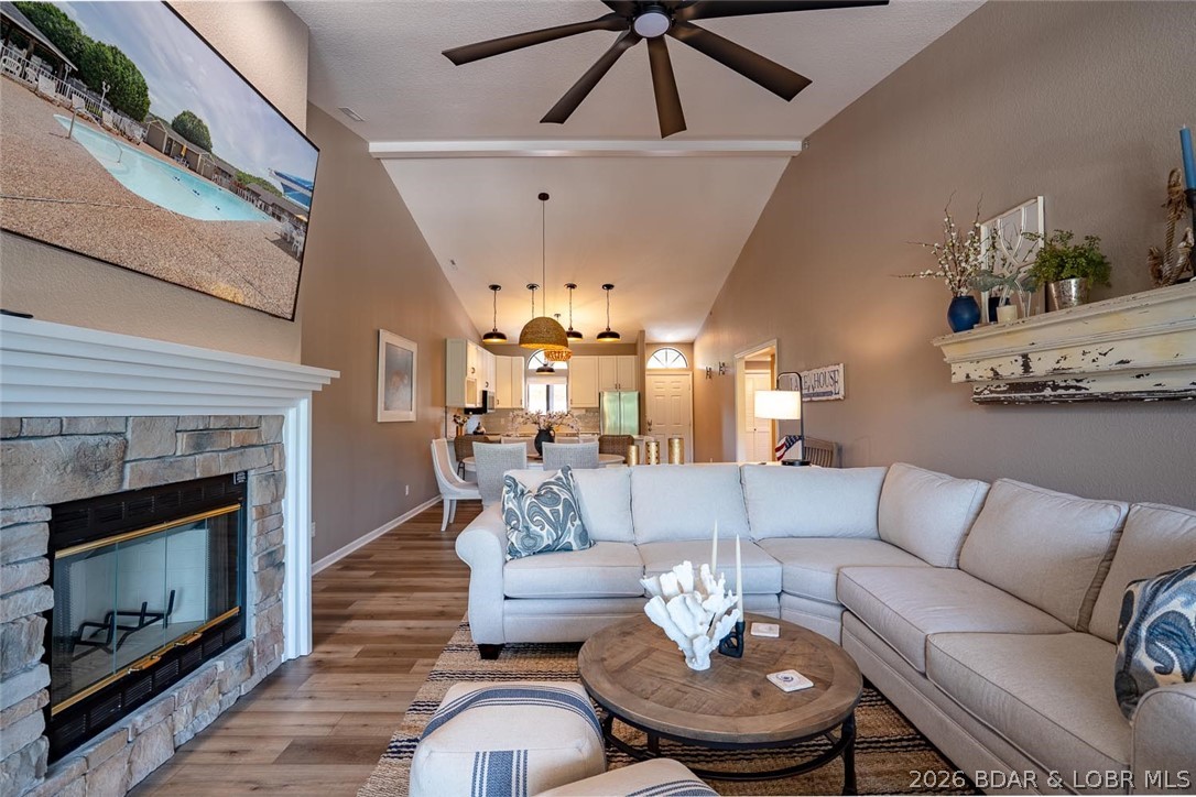 This top-floor Lazy Days condo shows like brand new and is being sold turnkey! This unit has never been on a rental program and has been recently remodeled with fresh paint, new LVP flooring, new carpet, new countertops, and updated appliances throughout, offering a truly move-in-ready opportunity. Vaulted ceilings create an open and spacious feel throughout the living area, while the large, well-designed kitchen provides plenty of space for the chef in the family. Tastefully finished with quality upgrades throughout, this condo has a warm, modern, and inviting feel. Enjoy relaxing on the screened-in covered decks featuring a private storage area and beautiful views of the Grand Glaize Arm from its protected cove location. The unit includes a 12 x 40 boat slip, providing excellent room for your boat and lake toys. A garage is also available for an additional cost, offering added convenience and storage. Completely furnished and truly turnkey, this Lazy Days condo includes everything you need—dishes, silverware, linens, and more. Just bring your toothbrush and clothes and start enjoying lake life today!