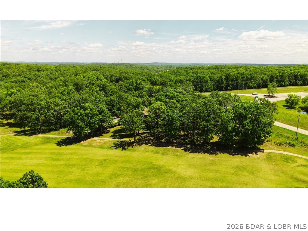 Flat, usable ground is getting harder to find—especially in a spot like this. This half-acre lot in Indian Creek Golf Club gives you a rare combination of build-ready terrain, mature trees for character, and a location that puts you right in the middle of everything.

Situated directly across from the movie theater in Laurie, you’re just minutes from local favorites for dining, drinks, and everyday essentials—without sacrificing the quieter feel of a golf course community.

Whether you’re planning a full-time residence, weekend escape, or future investment, this lot offers:

Level ground (lower build costs, easier design options)
Scattered mature trees for natural shade and curb appeal
Golf course community setting
Quick access to shopping, restaurants, and entertainment
Convenient proximity to the Lake of the Ozarks area

Opportunities like this don’t come up often—a clean, flat lot in a central location that actually makes daily living easy.

Build what you want. Enjoy where you are.