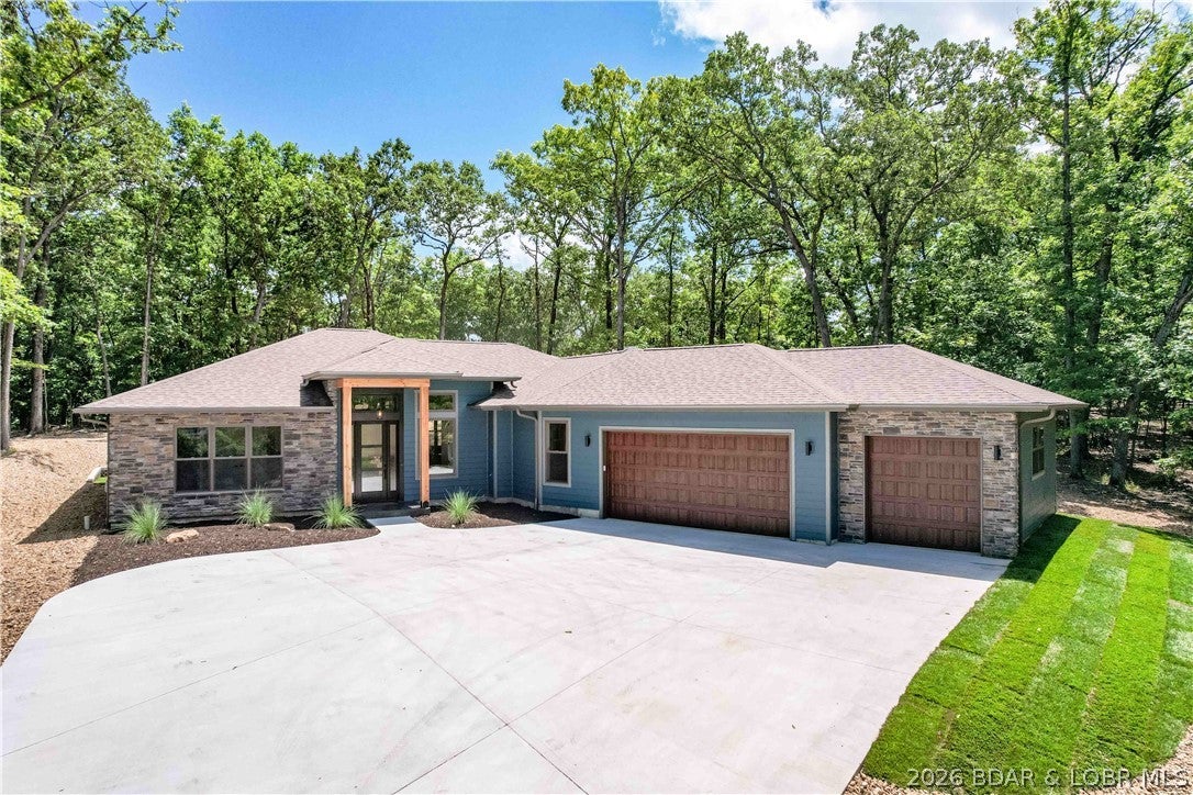Experience unparalleled modern living in this exquisite new construction home, thoughtfully designed for luxury & comfort. The kitchen is expertly designed with custom cabinets, coffee bar, quartz countertops, & an oversized island offering additional storage. Tray ceilings with wood inlay extend sophistication throughout, including the screened-in patio with stamped & stained concrete. Enjoy breathtaking year-round lake views through floor-to-ceiling windows that flood the home with natural light. An open concept design, perfect for entertaining or just relaxing. You’ll appreciate luxurious primary suite, a serene retreat featuring a soaking tub, walk-in shower, expansive walk-in closet, & a private patio. Guests are treated to spacious bedrooms, each with a well-appointed ensuite. Built to superior standards with 2x6 construction and 8-foot doors, the home includes an oversized driveway leading to a 3-car garage & additional parking. Pre-wired for media & security, this property is nestled in the coveted Porto Cima community, offering exclusive golf & yacht club memberships alongside Four Seasons amenities like pools, a clubhouse, fitness center, golf, a dog park, & playground.