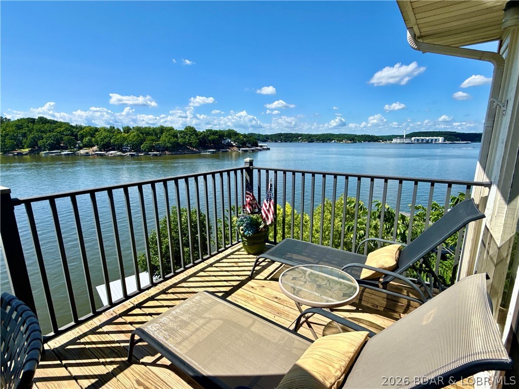 RARE CONDO NOW AVAILABLE!! Jonathan's Landing top floor, end unit, 3 bedroom condo in Downing Branch Cove w/BIG lake views of the 4mm Main Channel can now be yours! Loved by one family for 23 years, now ready for someone to make it their own, love it & start making lifelong lake memories! Fully Furnished, 3 bedrooms, 2 full bathrooms, 1143 sqft, vaulted ceilings, floor to ceiling lakeside windows & slider doors to the lakeside deck in Master Bedroom, open lakeside deck, New HVAC in 2022, native stone fireplace, boat slip, amazing community club house, community pool & hot tub. Wonderful group of longtime complex owners & no nightly vacation rentals allowed. Jonathan's Landing is a self managed & meticulously maintained condo complex. Perfect location by land & water...just off Horseshoe Bend Pkwy in Lake Ozark, close to Bagnell Dam Strip, Docknockers, Boathouse, LO Cafe, Tap N Grill, H.Toads/Shady Gators, etc...Ready for your personal touches to make it your perfect Lake Get-A-Way or full time lake life! Love Lake Life...& this condo is the perfect opportunity to have it!!