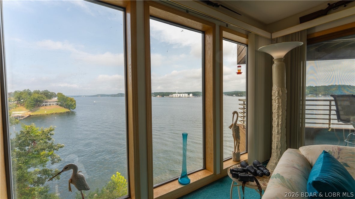 Walk right in and start enjoying lake life! This spacious 2 bedroom, 2 bath condo at The Breakers offers 1,350 sq. ft. with highly desirable walk-in level access and no steps. Located at the 3 Mile Marker of the Osage Arm, you'll enjoy fantastic, unobstructed lake views. The condo comes furnished and is ready to enjoy, with plenty of opportunity to add your own personal touches over time. An exceptional value at The Breakers, this is currently the lowest priced unit in the complex. Included is a 12x32 boat slip tucked in a protected cove location, plus a PWC space. With easy access, generous square footage, beautiful views, furnishings, and boating amenities already in place, this is a wonderful opportunity to own at The Breakers and make it your own Lake of the Ozarks getaway!