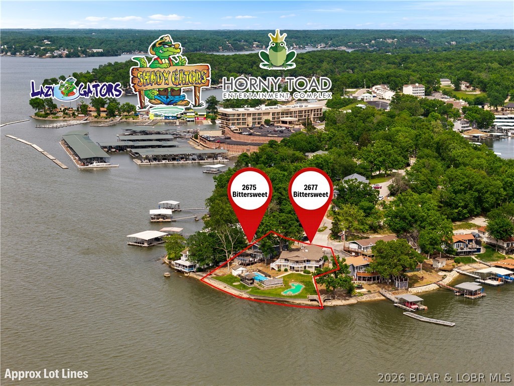 This rare Lake of the Ozarks investment opportunity features TWO fully furnished lakefront homes, each with its own private pool, positioned on one of the most desirable stretches of the lake with breathtaking main channel views at the 7 Mile Marker. Designed for entertainment and high-performing nightly rentals, this property is loaded with resort-style amenities including a putting green, tiki bar, private boat ramp, and two martini decks perfectly positioned for sunset views and lakefront entertaining. Located in the heart of the action, guests are just minutes by water or land from some of the lake’s most iconic destinations including Shady Gators, Camden on the Lake, and Alhonna Resort — making this one of the premier vacation rental locations at Lake of the Ozarks. With exceptional short-term rental income history and strong future earning potential, this property offers the ultimate combination of luxury, entertainment, and investment performance. Whether you’re looking to expand your portfolio or own a one-of-a-kind compound for personal enjoyment & income generation, opportunities like this rarely hit the market.