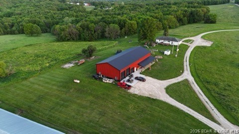 102+/-acres with 2 homes! Convenient location a few miles from Sedalia and only 1/4 mile of county maintained gravel from a paved highway. One of the poultry barns was destroyed by a storm, however remaining buildings just had the last flock sold in May, 2025. They could be also be used for storage or replaced with new buildings. There is a second well for the buildings, propane tanks, and a dedicated generator. The land is mixed open and wooded, with over a 1,00 feet of county road frontage providing multiple entrance opportunities! 2022 Shouse has 7 bedrooms, 3 bathrooms, family room, entertaining area or exercise room, office, and 2 laundry areas. Exceptional features are the granite countertops in kitchen and bathrooms, heated concrete floors on the main level and vaulted ceiling. The attached shop/garage is large with 4 overhead garage doors, 2 that are 14' x12', a 10'x10', and an 8'x8' for vehicles from large to small! The floors are heated concrete! 2nd home is a 3 bedroom, 2 bathroom, ranch style home on a full basement, that can be a rental, guest home or for granny or in-laws. You need to see this amazing property!
Features
