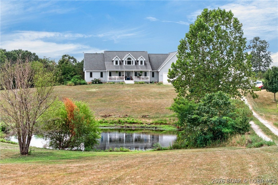 Welcome to your private country retreat! Nestled on 10 picturesque acres just 5 minutes west of Richland, this extensively remodeled home offers modern comfort and peaceful rural living. Enter past two stocked ponds to landscaped grounds featuring a 24-tree orchard, raised garden beds, and a grape arbor.
Inside, the home boasts a stunning kitchen with granite countertops, butcher block island, white soft-close cabinetry, and a 5-burner gas cooktop. The main level includes a spacious primary suite with a renovated bath and walk-in closet, office, formal dining room, and an inviting living room with a gas fireplace. Upstairs, two large bedrooms each feature updated en-suite bathrooms.
The finished basement is perfect for entertaining with a kitchenette, bar, pool table space, workout area, updated bath, and an in-ground storm shelter. Outside, enjoy the front porch or the expansive 20' x 36' Trex deck.
An oversized two-car garage includes workshop space and a large finished bonus room above with its own mini-split HVAC. Recent updates include a new HVAC (2025), well pump (2023), water heater (2022), and an outdoor wood furnace. Exceptional rural living at its finest!