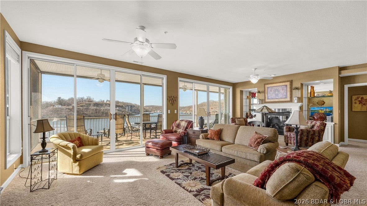 LAKEFRONT BEST BUY AT SUMMER PLACE! Priced at $469,000, this is the LOWEST-PRICED 3-bedroom waterfront condo currently available at Summer Place, offering an impressive 2,084 sq ft, 3 bedrooms, 3.5 baths, furnishings AND a 12x32 boat slip with 8,000 lb lift. The spacious single-level floor plan was made for lake living, with an open kitchen, dining and living area, gas fireplace and plenty of room to gather family and friends. Step outside to the HUGE south-facing screened deck spanning the length of the condo, with peaceful cove water and main channel views. Each bedroom has its own private bath, a great setup for family and guests. The elevator is right at the front door and takes you to dock level, with your slip conveniently located in front of the building. Summer Place offers 2 pools, hot tub, clubhouse, pickleball, and a new fitness room. No short term rentals allowed. Optional 1-car garage available for $35,000. If you've been waiting for VALUE at Summer Place, this is it!