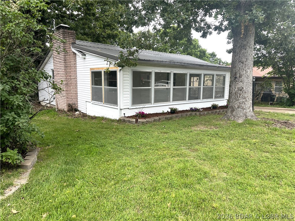 Located at the 86MM of the Lake of the Ozarks, this recently remodeled lake cabin is ready for you to decorate and pick out your own appliances with an allowance from the Seller! Featuring New plumbing, electrical, LVP flooring, enclosed sunroom, a new mini-split, and a wood-burning fireplace. A nice sized driveway gives you plenty of room to park your boat. Just a short 2-minute drive to the Community Boat Docks & Ramp, Shelter House with Playground you'll be ready to host family gatherings and head out on water in no time!