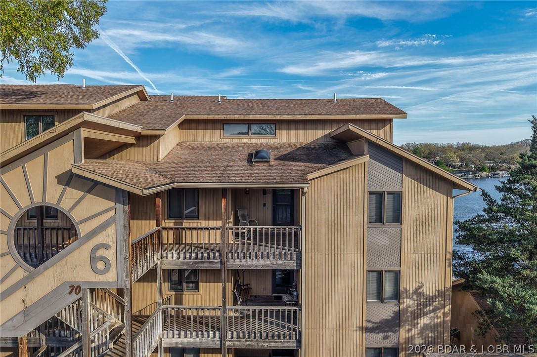 HUGE PRICE REDUCTION! Beautiful Lake Views in this sought after well established complex located on the Osage 10m.m. at Lake of The Ozarks. This top floor end unit comes with a 16x40 dock slip right in front of this unit and (2) single car garages straight across from unit. 3 bdrms all have attached full baths and 2 bdrms have 2 large walk in closets each. 4th bdrm is small with no closet and would also make a great office. Amenities include a large clubhouse with hot tub, sauna's, workout room, game room, outdoor pool, tennis/pickleball court, storm shelter and boat ramp. Great location by land and water for all your activities just a short distance off Hwy.5