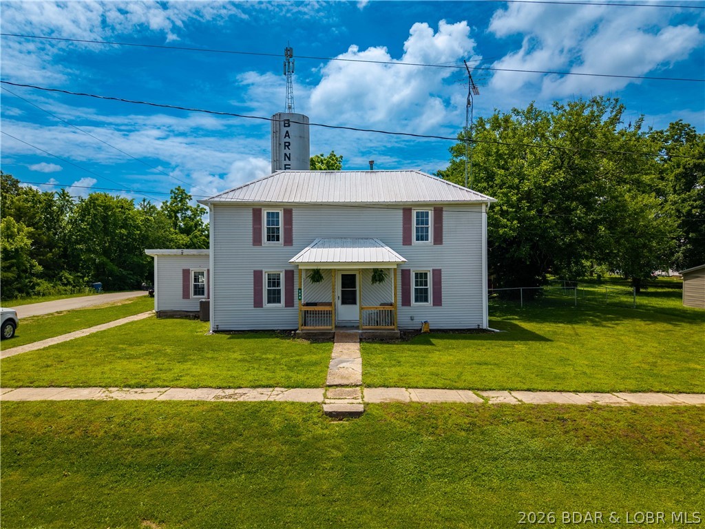 Timeless Americana character meets modern updates in this 3-bedroom, 1.5-bath Traditional American Four Square situated on a HUGE corner lot! Major improvements have already been completed, including updates from the floor joists and sub-floors up, remodeled kitchen, updated bathrooms, brand new HVAC system, vinyl windows and durable metal roof—allowing you to move in with confidence the most critical updates in all the main living areas & main level en-suite have been done. Inside, you'll find the charm of finished hardwood floors, fully functional kitchen and spaciousness this classic design is known for, paired with modern functionality. Step outside to a fully fenced backyard built for entertaining and relaxation, featuring a hot tub, fire pit, and detached storage shed that all convey with the property.

Connected to Barnett city water and sewer, this home offers the convenience of in-town utilities with plenty of outdoor space to enjoy. Whether you're looking for your first home, a family home, or simply a property with the big-ticket updates already done, this one checks all the boxes!