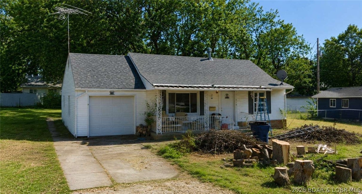Turnkey and livable with just a little cosmetic freshening needed — this 1954-built home sits on a no-HOA lot with an attached one-car garage and extra parking. Plumbing and electrical are up to code, the roof is 8 years old, and central AC is in place. Flooring, paint, and finishing out half of a bathroom still need to be done. The 1,146-square-foot layout offers two bedrooms and two full bathrooms. Move in now and update at your own pace, or knock out the cosmetic list first for instant equity. Eldon offers small-town convenience with easy access to the Lake of the Ozarks, making it a solid long-term hold or resale.