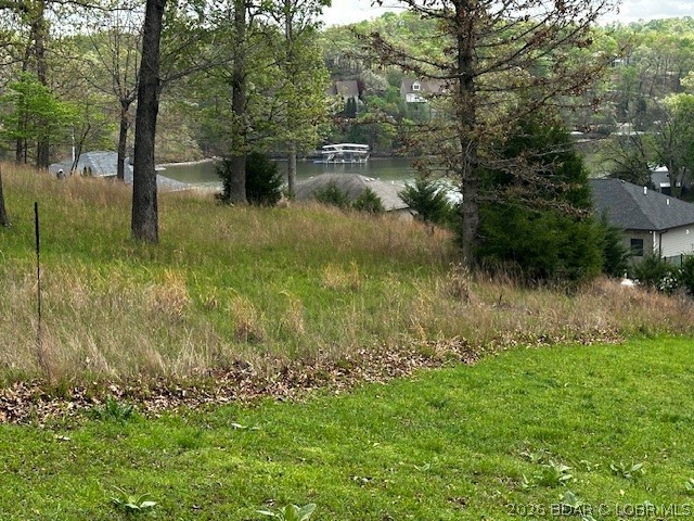 Discover the perfect spot for your Lake lifestyle with this exceptional second-tier lot.  Enjoy the peace and quiet of a cozy subdivision, while enjoying this beautiful lake view from your new home!  This lot has been cleared of most trees, saving you time and money!  Water, sewer and electric are ready for you to hook up, again, saving you $$$
There is an additional lot available, for a total of 1+ acres if you're looking for more space.