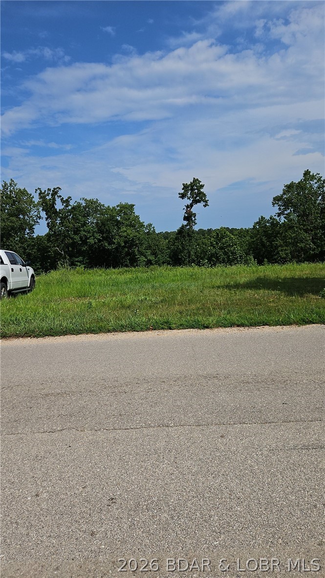 Welcome to the perfect building lot within a couple miles to downtown Laurie, MO. Beautiful oversized flat lot already cleared and ready to go. Seller already went to the expense to have sewer and water bored under the road and have it ready to use on site and electric on site as well. Blacktop roads right up to it. This has all the infrastructure already in place just waiting for your building plans.