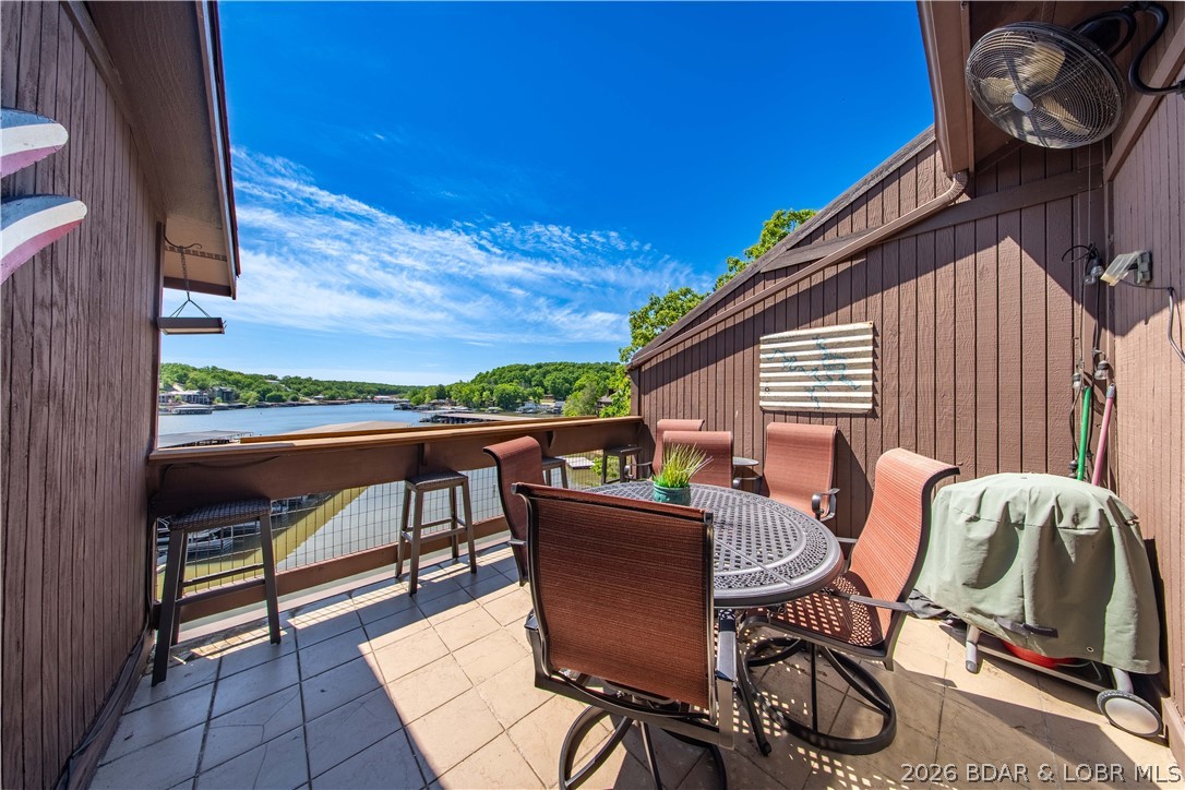 Top-floor lakefront condo offering some of the best views at The Knolls—no neighbors above for added privacy. This renovated 3-bedroom, 3-bath unit features approximately 1,580 square feet and a highly desirable lockout design, allowing the property to function as two separate rental units an excellent opportunity for maximizing rental income and flexibility. Recent updates include custom kitchen cabinetry, granite countertops, updated appliances, tile flooring, newer vanities, and fixtures. The open layout provides a main-level primary suite, with an additional private suite in the upper loft, creating ideal separation for guests or renters. Step out onto the spacious deck and take in panoramic lake views, with the ability to see your included 10x24 boat slip. The Knolls is a well-established, amenity-rich community featuring indoor & outdoor pools, tennis & pickleball courts, lakefront swim area, sauna, fitness center, playground, boat ramp, and on-site management making it highly attractive for all. A rare opportunity to own a versatile lakefront property with strong rental potential in one of the area’s most sought-after complexes.