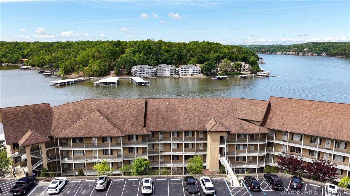 Priced to sell! Currently the only condo available for sale at Tuscany Condominiums, this spacious 3-bedroom, 2-bath lakefront condo offers 1,466 sq. ft. of comfortable one-level living near Camdenton at the 1 Mile Marker of the Big Niangua Arm. Convenient elevator access brings you just one level down from parking. Inside, you'll find a well-maintained, move-in-ready condo with all appliances included, including a full-size washer and dryer. Step outside to the impressive 315 sq. ft. screened deck with tile flooring—an ideal spot for morning coffee, entertaining, or simply enjoying the Lake. A 12' x 32' boat slip is included and located in a protected deep-water cove with convenient access to the main channel. Tuscany amenities include a community pool, clubhouse, exercise room, beautifully maintained grounds, and more. Offered unfurnished and ready to make your own. Whether you're looking for a full-time residence or Lake getaway, this is an opportunity to get into a desirable Lake of the Ozarks condominium community at a compelling price. Motivated seller—bring an offer!