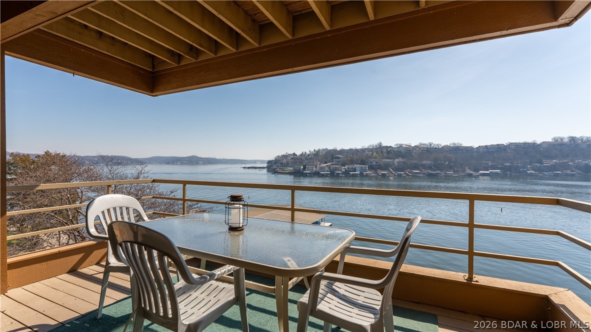 Cove location with sweeping main channel views makes this 3BR/3BA truly desirable. Ideally situated near lake favorites by both land and water, you can enjoy the energy of the lake-or retreat to nearly 2,000 sq ft of living spaced designed for comfort, peace and relaxation. A boat slip plus two PWC slips provide effortless access to days on the water, whether you are cruising, swimming, or heading to your favorite waterfront sports. Floor-to-ceiling windows showcase stunning views from the main living areas and every bedroom, bringing the beauty of the lake into your everyday living.  Perfect for full-time living or a weekend escape, this condo offers the best of both worlds - calm cove waters, expansive views and a relaxed lake lifestyle.  This is where peaceful lake days and wide-open views come together. 32-1B is a place you'll never want to leave...make it your piece of paradise.