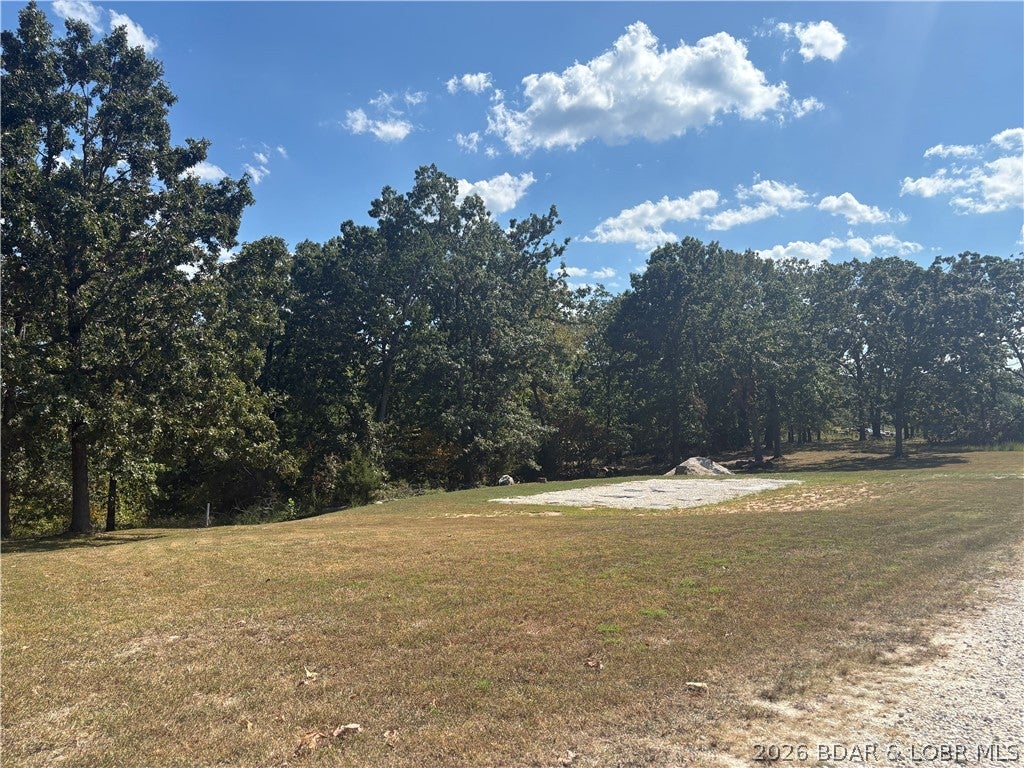 A great opportunity to build in a convenient Sunrise Beach location! This just-under-one-acre parcel features a mostly cleared, level homesite, offering a great foundation for your future home. City water and city sewer are available, with electric and high-speed internet already run to the property. Enjoy the space of a larger parcel while being just minutes from Sunrise Beach shopping, dining, and amenities, as well as the Lake of the Ozarks. Frankie & Louie’s popular lakefront restaurant is approximately five minutes away. If you’ve been looking for a spacious homesite with utilities already in place and a convenient location, take a look at 244 Hawk Lake Drive and start planning your next move.