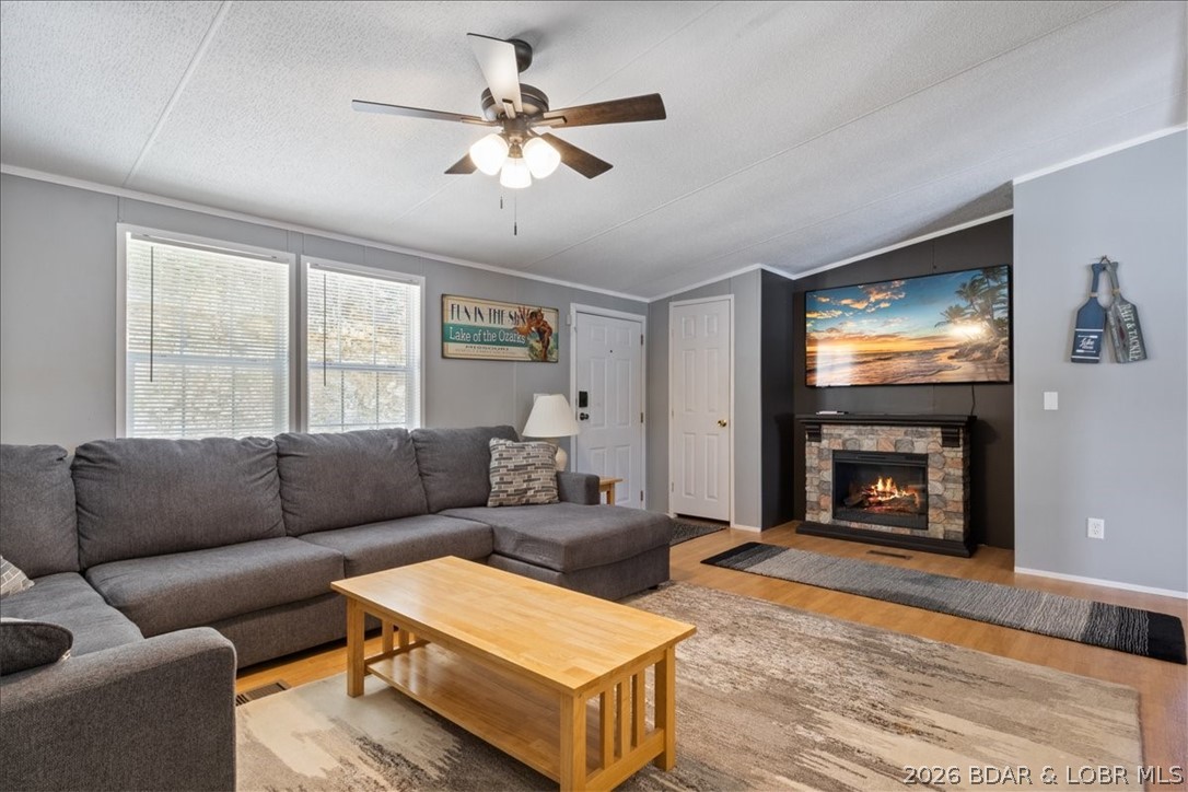 Discover this beautifully updated 4-bedroom, 3-bath lakefront home showcasing breathtaking views of the Gravois Arm at the 7 MM. Whether you're searching for a full-time residence, weekend retreat, or a proven investment property, this home truly checks every box. The main level features a well-appointed kitchen with updated appliances, a spacious living room highlighted by a cozy electric fireplace, and a private primary en-suite. Two guest bedrooms, a second full bath, and a convenient laundry area complete this level. Step outside onto the upper deck and take in sweeping lake views - perfect for relaxing or entertaining. The lower level offers a private fourth bedroom with a sitting area, a third full bath, and its own separate entrance and another deck, making it ideal for guests or rental use. Outdoor enjoyment continues with a firepit area on the way to a 2-well dock with swim platform, and Wet Steps, ensuring effortless lake access and endless fun - deep water year-round. New HVAC in 2025. Nightly rentals are allowed, making this property an exceptional investment opportunity on the lake.