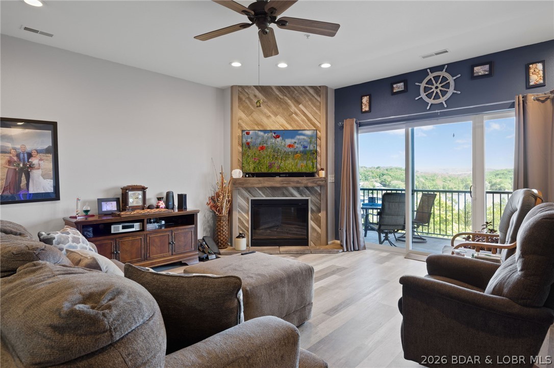 MOTIVATED SELLERS!!! Experience lakefront living at its finest in this beautifully updated 3-bedroom, 2-bath condo overlooking the breathtaking Big Niangua at the 13-mile marker. Well maintained community with 3 pools!!! Perched perfectly for million-dollar views and direct lake access, this lower-level, fully handicap-accessible unit offers comfort, convenience, and style. Enjoy luxury vinyl plank flooring, tile finishes, and a spacious walk-in shower complete with grab bars. The open-concept layout flows seamlessly to outdoor living where you can take in panoramic water views. Included is a coveted 10x24 boat slip in the community dock, for fishing and boating.  A garage is available for extra $, perfect to store a golf cart or your lake toys. Handicap parking is conveniently located nearby, making access effortless. Whether you're looking for a full-time residence or the perfect lake getaway, this condo combines accessibility, luxury, and unbeatable lakefront living.