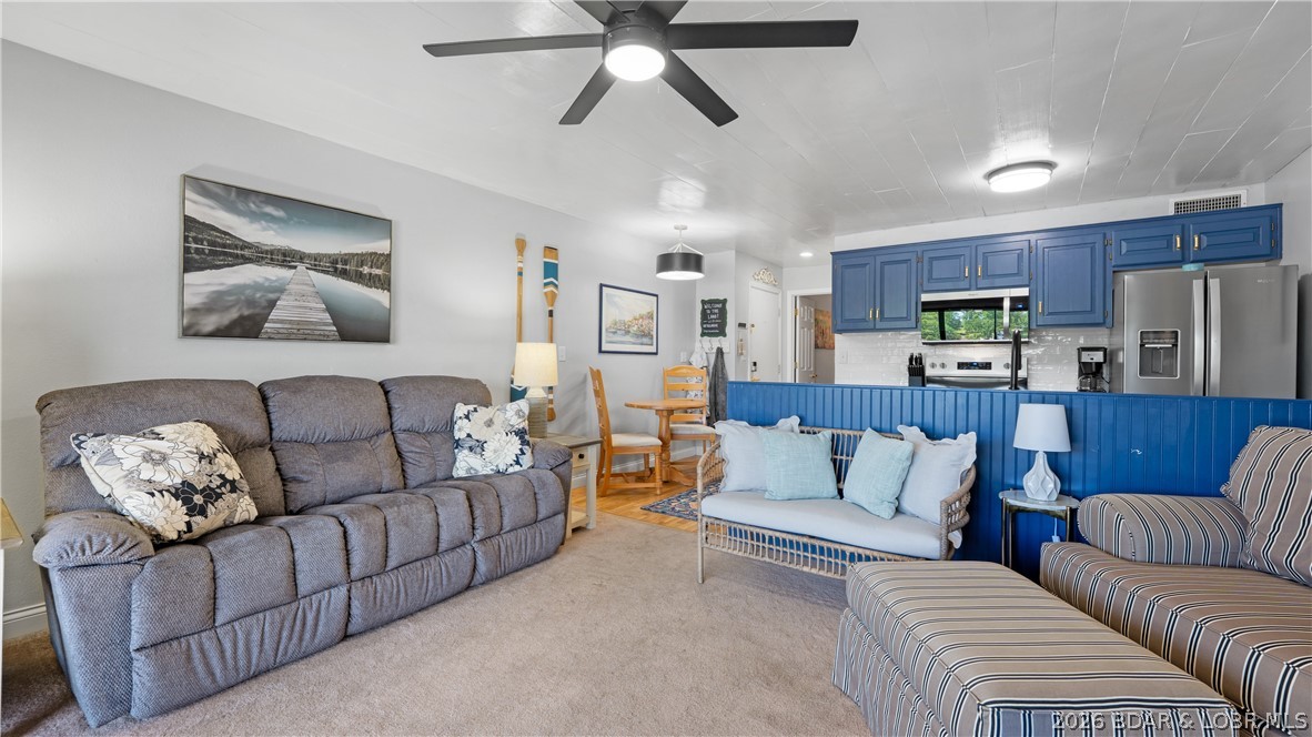 TOP-FLOOR WALK-IN WITH A VIEW! This Harbor Point condo checks the boxes buyers love most at Lake of the Ozarks — top floor, zero steps, big water views, a screened lakeside deck, turnkey furnishings, nightly rental potential, and a 10x26 boat slip in a protected no-wake cove. Located at the 21MM, this 1BR/1BA condo offers beautiful views of the cove and main channel, making it the perfect Lake getaway, investment property, or easy-to-enjoy personal retreat. Recent updates include newer flooring, ceiling fans, lighting, bath vanity/mirror, stainless refrigerator, range, microwave, dishwasher, disposal, keyless entry, and newer HVAC. You will also appreciate the in-unit washer/dryer, assigned parking, heated lakeside pool, clubhouse, boat ramp, trailer parking, and newly painted pickleball court. Best of all, you are right in the heart of Osage Beach, close to lakefront dining, shopping, entertainment, golf, medical care, and everything that makes Lake life fun. Updated, furnished, rental-friendly, walk-in, top-floor, and complete with a boat slip — this is a rare package at this price point. Schedule your private showing today and come see why this one is such a smart Lake move!
