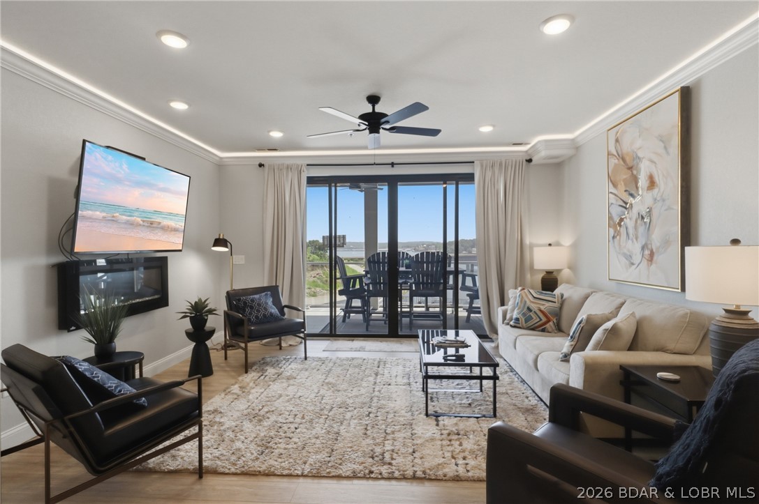 POWERHOUSE INVESTMENT AT TOPSIDER: NIGHTLY RENTALS ALLOWED. Welcome to luxury lake living in the heart of Osage Beach. This 1,600 sq ft, 3 BR, 3 BA fourth-floor unit sits steps from the elevator, offering the ultimate turn-key investment or high end family retreat where short-term rentals are fully permitted. Four-panel, floor-to-ceiling glass sliders in both the living room and master suite open to an expansive, tiled lakeside deck with views of the resort action. High-end upgrades run throughout: quartz countertops, a herringbone tile backsplash, Koch quiet-close cabinets, crown molding with custom LED accent lighting, and beautifully tiled showers. The ultimate kicker? This unit comes with a massive, rare 18x50 cruiser slip plus a PWC slip. Resort amenities feature two million-dollar-plus pools (one heated), a clubhouse with fitness facilities, pickleball and sand volleyball courts, a dog park, and lakeside fire pits. Located just minutes from the lake’s premier dining, shopping, and entertainment hotspots by land or water, this property is engineered for maximum fun and rental ROI. Secure your slice of the Ozarks today!