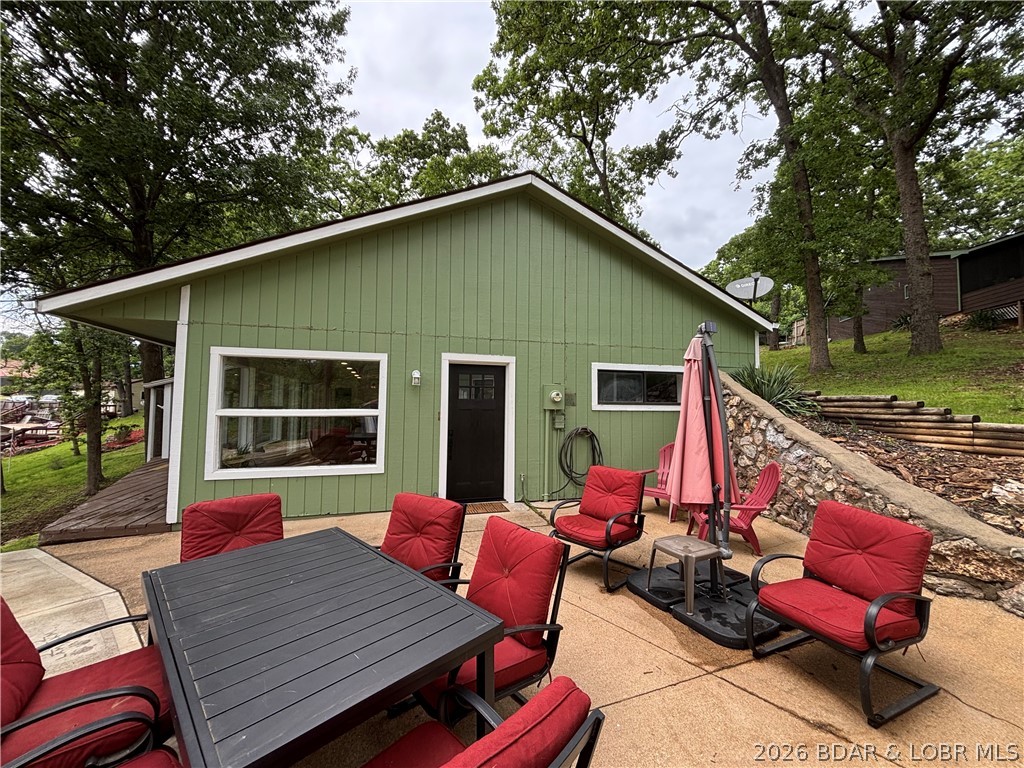 Completely remodeled in 2026, this move-in ready 3 bedroom, 2 bath lakeview home features all-new appliances, new flooring throughout, and a stunning kitchen with brand-new cabinets, countertops, and a large center island. Enjoy peace of mind with all new plumbing, plus an oversized 2-car garage and additional parking for guests or lake toys. Seller intends to repaint the home and garage prior to close.  Cove-protected community dock includes a slip and boat hoist, offering easy lake access and calmer water. Conveniently close to shopping, dining, and other amenities, this updated home delivers the best of comfort, convenience, and lake living.  Come take a look and experience what this beautiful home can be for your family!