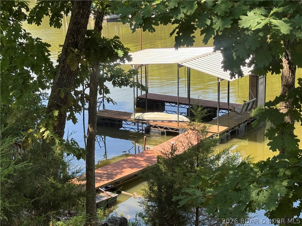 This rare lakefront retreat offers nearly 2 acres of privacy, an abundance of shoreline, and endless possibilities. Whether you’re looking for a peaceful full-time residence, a family compound, or an investment opportunity, properties like this seldom come along.
The inviting 2-bedroom, 2-bath home features vaulted ceilings, waterproof LVP flooring, newer carpet, a cozy wood-burning fireplace, and an open floor plan that was made for gathering with family and friends.
Outside, you’ll fall in love with the covered and screened porch, newly built fire pit area, storage shed, chicken coop, carport, and fenced property, all surrounded by the kind of privacy that is hard to find at the lake.
And then there’s the bonus everyone wants…a fully finished 1-bedroom, 1-bath guest house of approximately 390 sq.ft with its own utilities already in place. Perfect for guests, multi-generational living, a private office, or as an income-producing vacation rental. The possibilities are endless.
Private, versatile, and packed with potential, this is more than a home. It’s a lifestyle and an opportunity all in one. Square footage includes the guest house.
