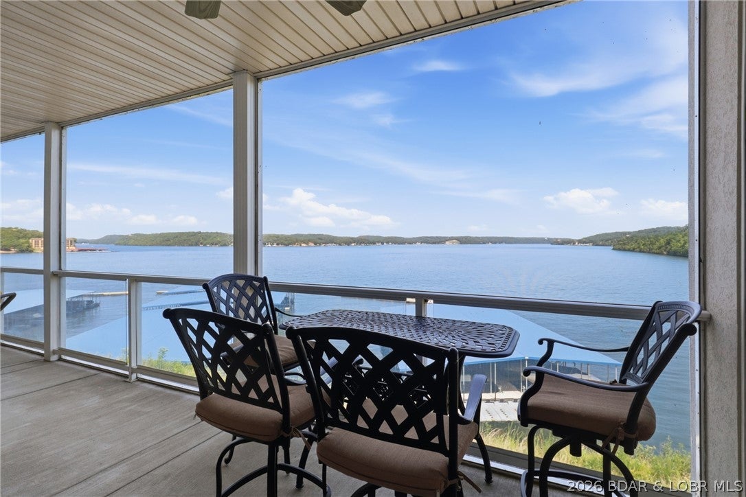 This is the Lake of the Ozarks lifestyle you've been waiting for! Enjoy breathtaking main-channel views at the 31MM from this beautifully remodeled 3BR/3BA Trinity Pointe condo. The wide-open kitchen and living area was made for entertaining, featuring custom cabinetry, newer appliances, striking quartzite countertops, stylish lighting, LVP flooring and a gas fireplace. Step onto the spacious screened deck and picture morning coffee overlooking the water. The primary suite captures gorgeous lake views and features a walk-in closet, dual floating vanities and walk-in shower. Best of all, the TOTAL LAKE PACKAGE is now included: a 12x36 boat slip PLUS 2 covered PWC slips with lifts! Need more room for your boat? An additional 16x44 slip is available for $25,000, or purchase it with a hoist for $35,000 additional. Elevator access makes trips to the pool, clubhouse and waterfront easy. Conveniently located minutes from Camdenton by land and near Larry's on the Lake, Fish & Co. and The Cave by water. Luxury, views and lake access come together here—make Trinity Pointe your place to escape, entertain and make unforgettable memories! Wave-protected community docks add peace of mind today!