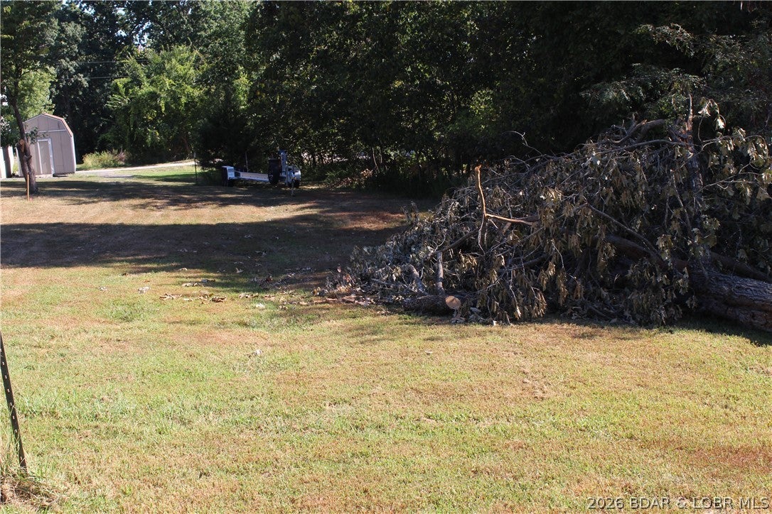 Building lot in Johnson's Bay Subdivision overlooking Gladstone Cove near the 3mm of the Gravois Arm of Lake of the Ozarks. Community water and sewer already in place lowers the building cost for building your new Lake of the Ozarks dream home!