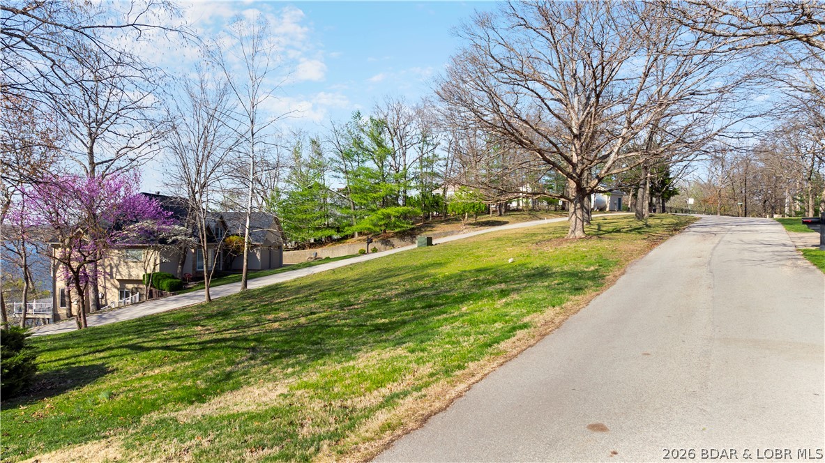 Great building lot in Osage Beach with a very nice view and a 12x28 boat slip in the community dock.  Robyn Point Subdivision is a great place to live.  The HOA provides water & sewer to all lot owners and a wonderful community pool overlooking the Lake, and next to the community dock.  Located in the heart of Osage Beach, both by land and water, and close to all the shopping and restaurants in town.  Easy access and a great building lot.  A 10,000 pound boat hoist is available for an additional $10,000.