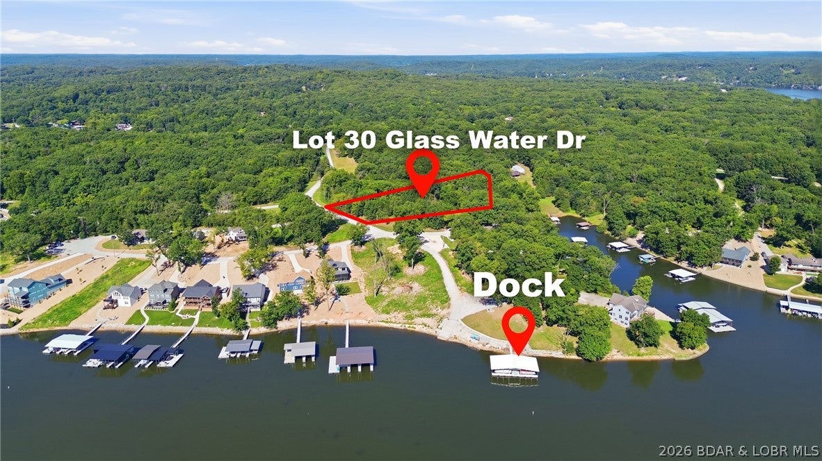 Shores of Eagles View on the 53 MM. Fantastic lot with Lakeview, boat ramp AND Boat slip with a boat hoist. Tritoon available for an extra fee while available. This Gentle sloping lot has a gazebo that conveys with the property, maintenance free dock, boat ramp, community green space and AMAZING views!! Ready to build your DREAM HOME? Schedule through Showing Time