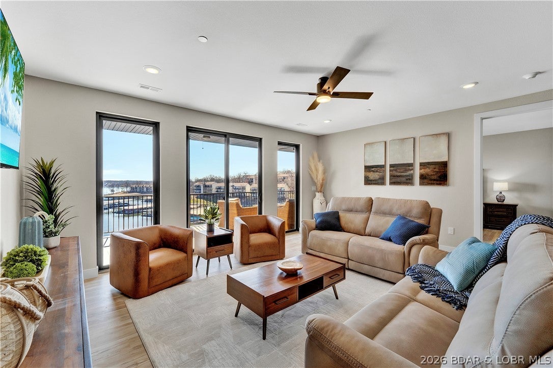 YOUR LAKE HOUSE—WITHOUT THE LAKE HOUSE WORK. INCREDIBLE VALUE! Experience refined, turnkey lakefront living in this exceptional end-unit at The Havens. New construction, beautifully furnished and designed for effortless weekends, entertaining and unforgettable time at the Lake. A wall of windows captures spectacular main-channel views, while the covered lakeside deck delivers the perfect blend of privacy, pool views and front-row seats to Four Seasons fireworks. Boaters will appreciate the impressive 14x44 slip and easy access to the water. Inside, sophisticated finishes create a warm, inviting retreat, including a distinctive barn door in the primary suite and a stunning statement light fixture above the kitchen island. The Havens offers resort-style amenities including pool, cabanas, outdoor kitchen, clubhouse, fitness center, walking trails, lakeside firepit, boat ramp and elevator access. Every detail is in place—no furnishing, remodeling or weekend maintenance required. Simply bring your suitcase, your boat and the people you love. Luxury, convenience and the Lake—all in one exceptional property.
