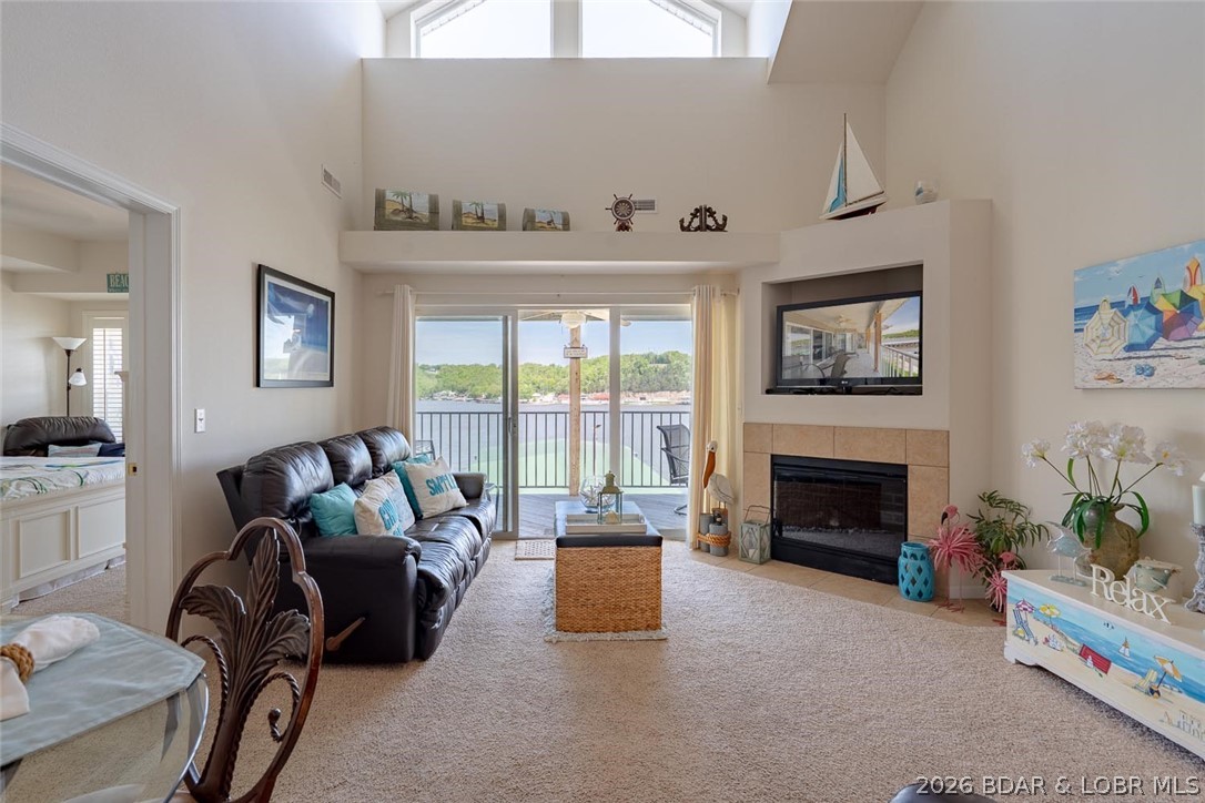 If your dream life includes coffee with a view and cocktails by the water...this condo is for YOU!!! This 2-bedroom, 2-bathroom condo is all about easy living and unforgettable views. It also features a loft to help sleep extra guests, and comes furnished with a 10x24 boat slip. Taking in the stunning views of the Niangua Arm - morning coffee and sunset cocktails just hit different here. And when you're ready for some FUN, you're just minutes away from the Nautifish Rum Bar and The Cave Bar & Grill, one of the lake's favorite waterfront hangouts. Whether you're looking for a weekend escape, investment opportunity, or full-time lake living, this condo checks all the boxes. Great location, incredible views, and the lake life vibe you've been dreaming of - Don't Miss Out!